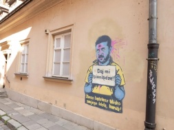 Неизвестные поляки нарисовали в центре Варшавы граффити с Зеленским, просящим деньги, на рисунке у него пробита  пулей голова
